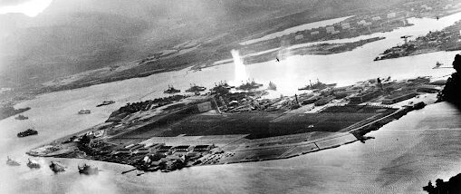 Black-and-white image of Pearl Harbor during Japanese attack